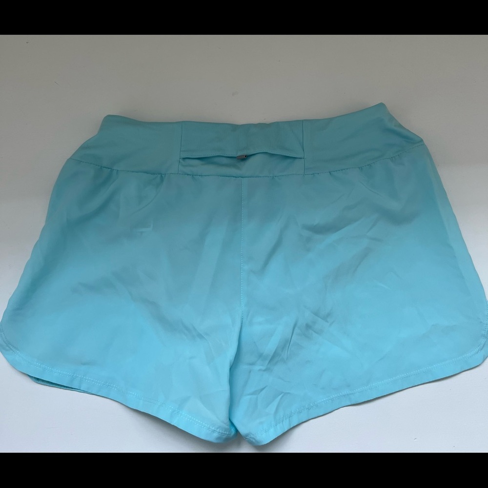 Nike Women’s small medium blue running shorts NWT